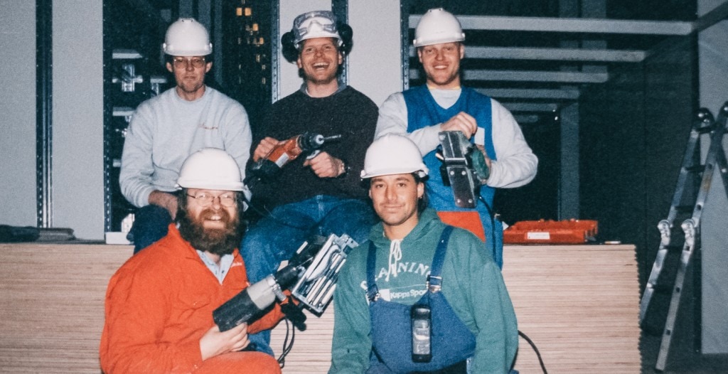 Old photo of Element Logic employees with power tools